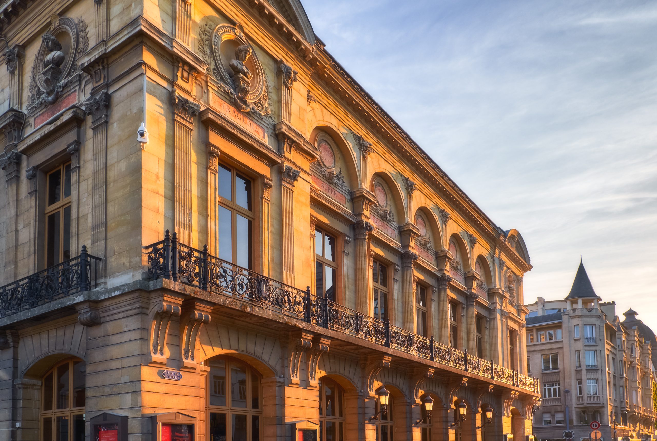 Orange light of Reims opera theater in city center, France